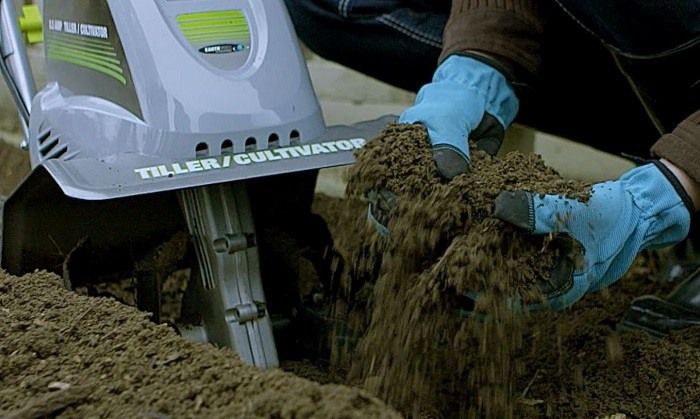 Man using earthwise cultivator